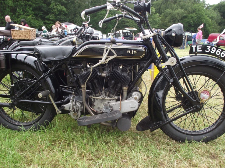 there is a motorcycle sitting on display at an antique event