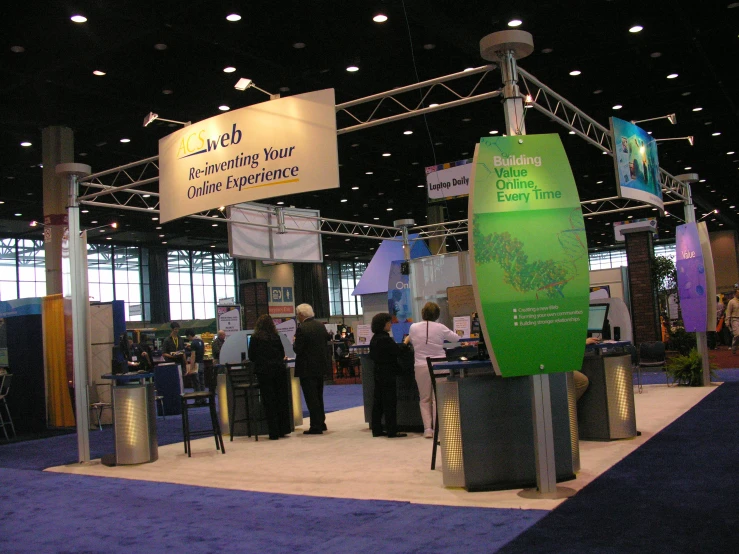 a large display of several advertising signs and people