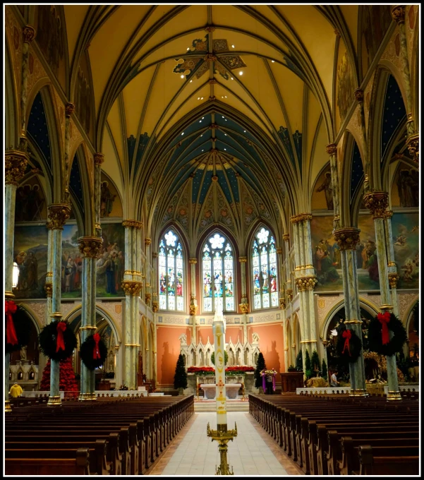 an ornate church interior with beautiful stained glass windows