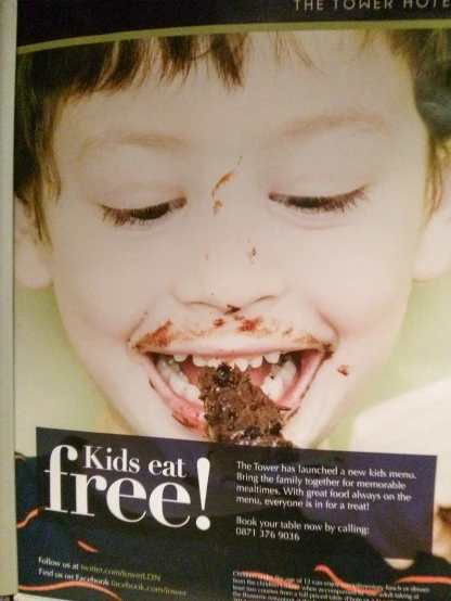 there is an advertit showing a child with food in it's mouth