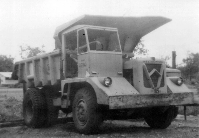 an old po of an army style truck with a gun inside