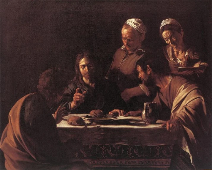 a group of people are at a table with food