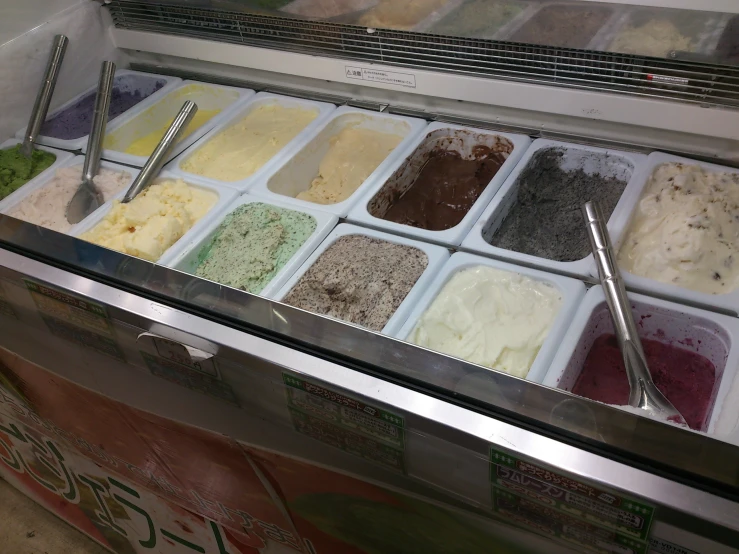a very colorful ice cream display in a store