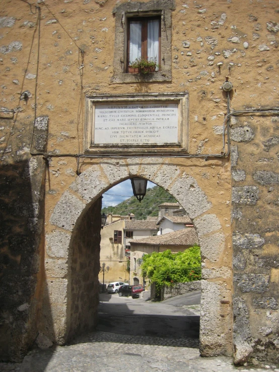 an arched doorway leading to another entrance in the town