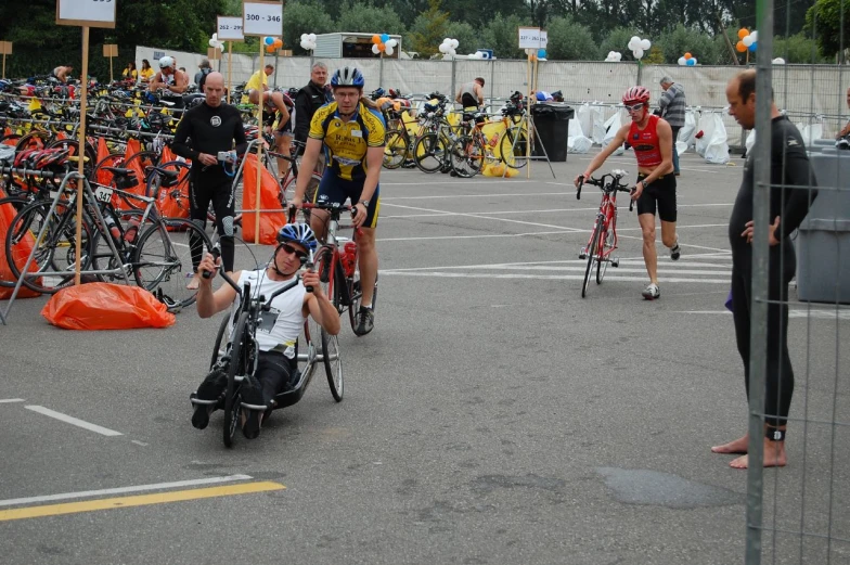 a person in a wheel chair is being led from a bike pit