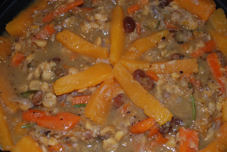 carrots, beans, meat and rice in a stew mixture