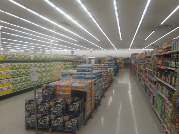 a large selection of sodas for sale are displayed in a store