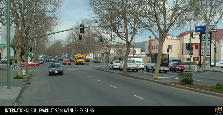 cars are on a busy city street in front of houses