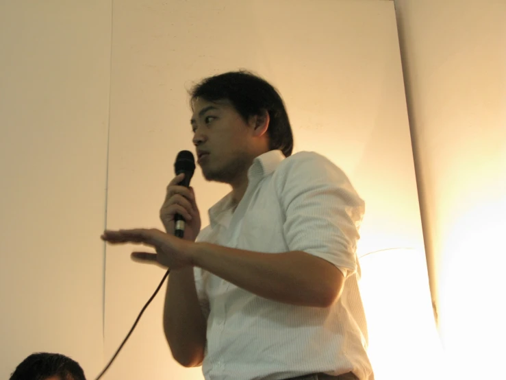 a man is speaking into a microphone