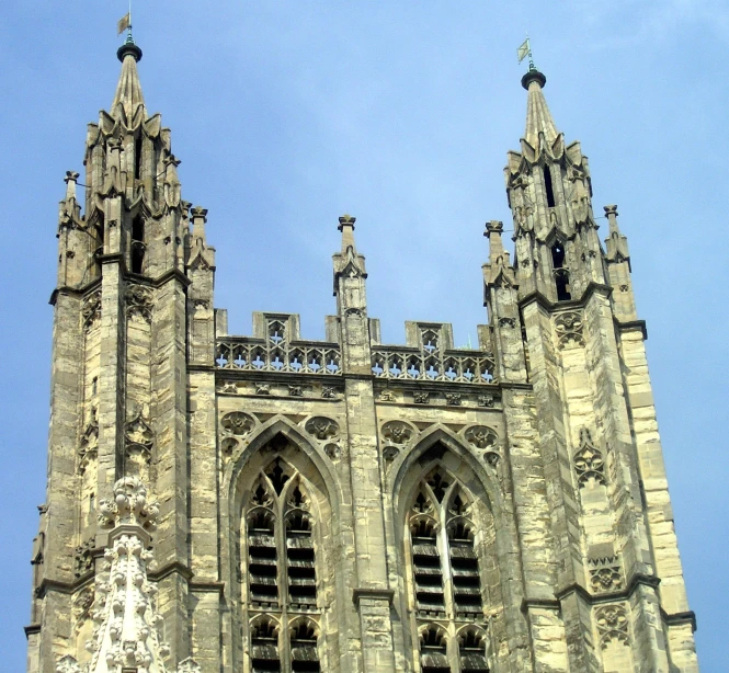 the tower is made up of stone with two clocks on each of them