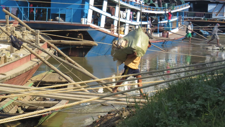 there is a man that is walking across the river