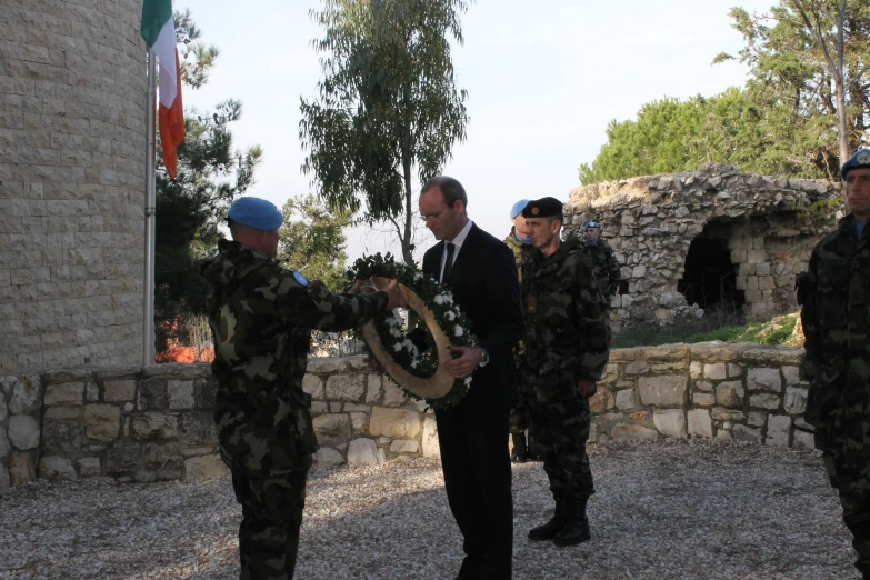 military officers are taking place at an official ceremony