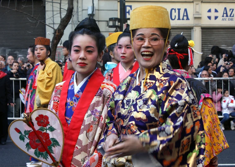 young people in brightly colored costumes standing near each other