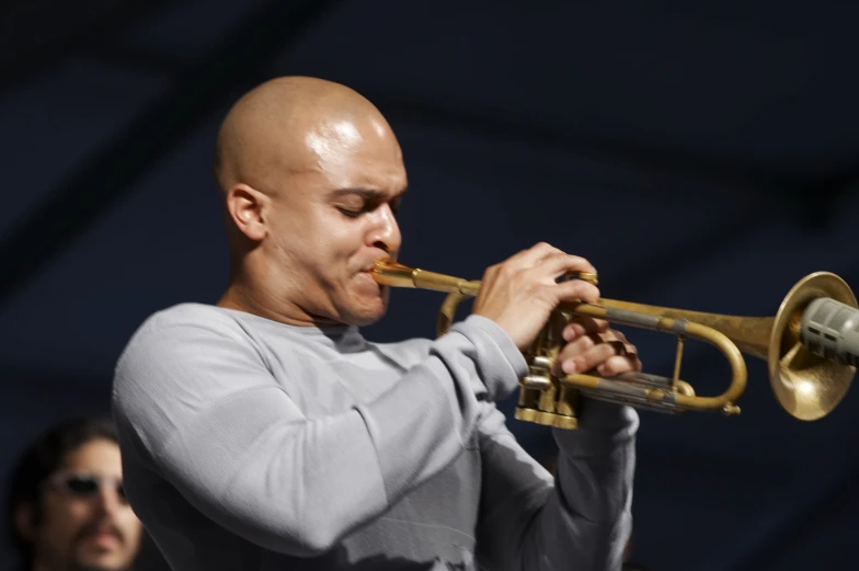 a man playing the trumpet at an event