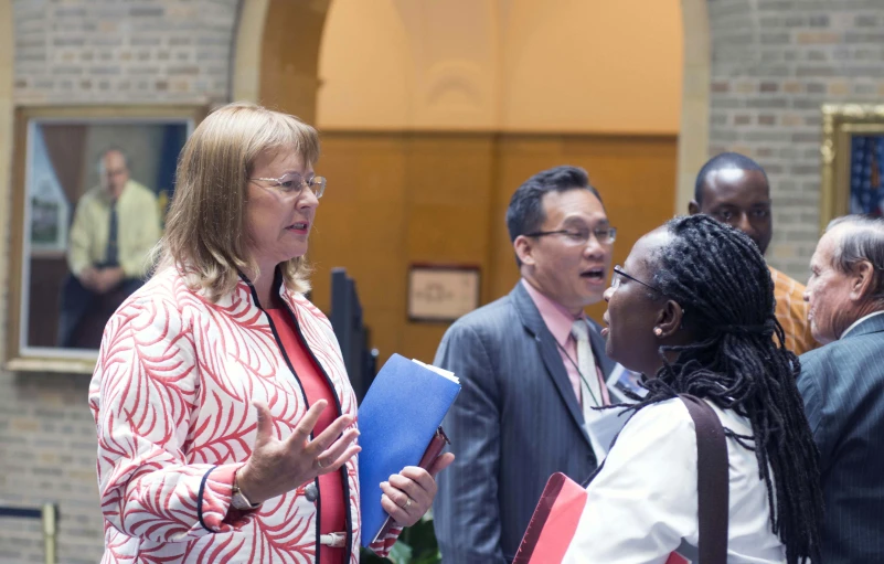 a group of people are standing in a church