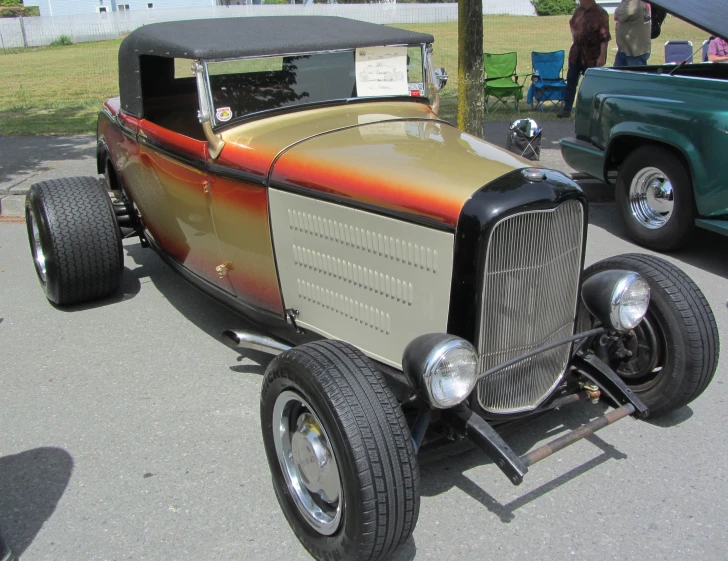 an old - fashioned  rod is parked on the side of the street