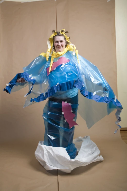 a person standing in an elaborate costume on a table