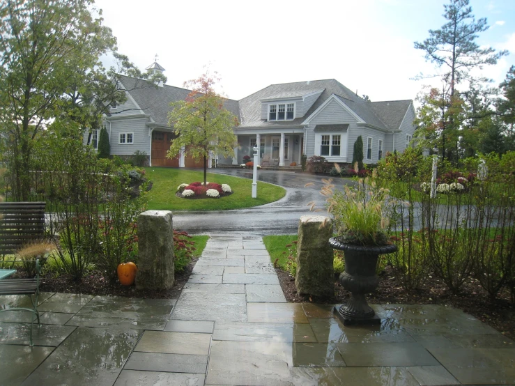 an outdoor home with a garden and path to it