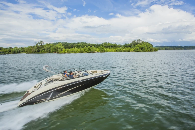 a jet ski speeding across the water on the lake