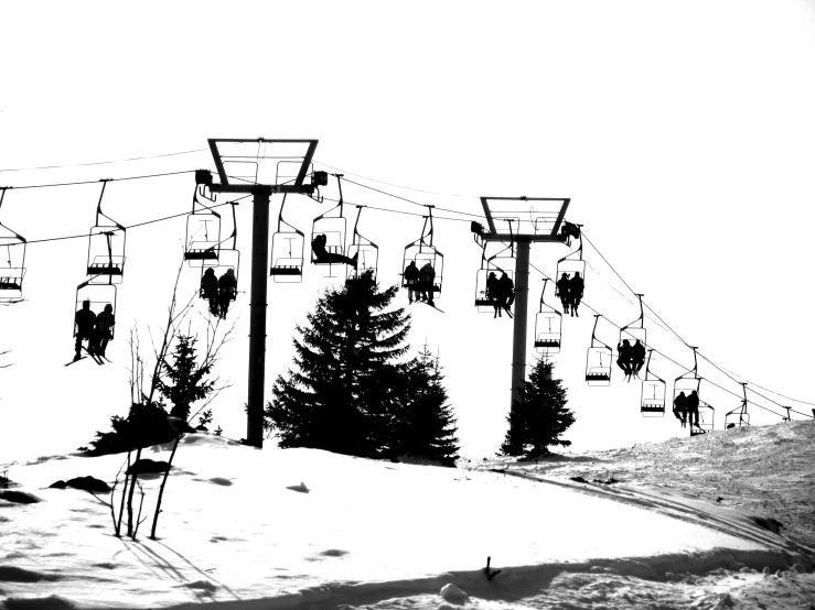 the ski lift has lots of people on it