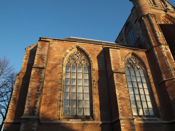 the building has many windows and a clock on it