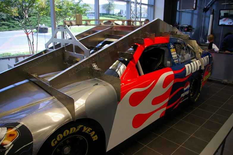 a custom modified race car in a garage