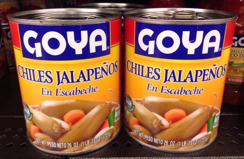 two canned soups that are on a shelf