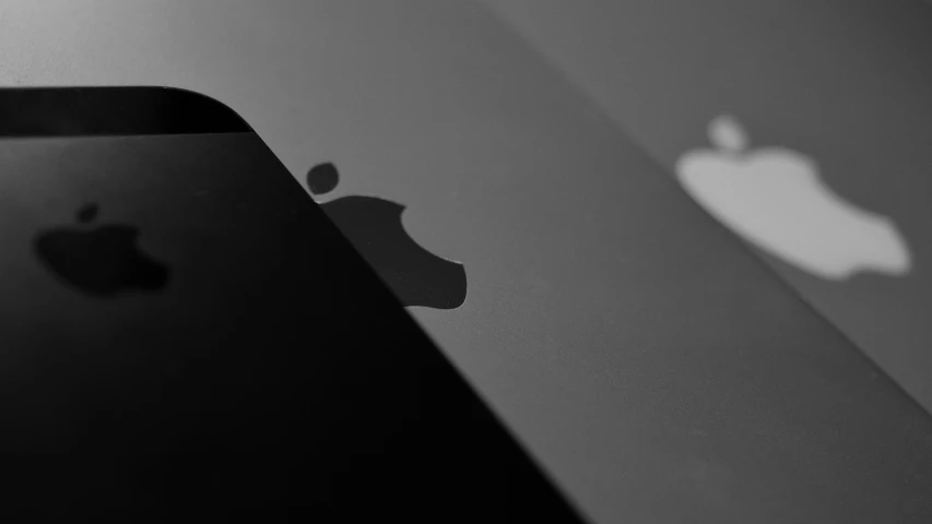 a black and white image of an apple iphone