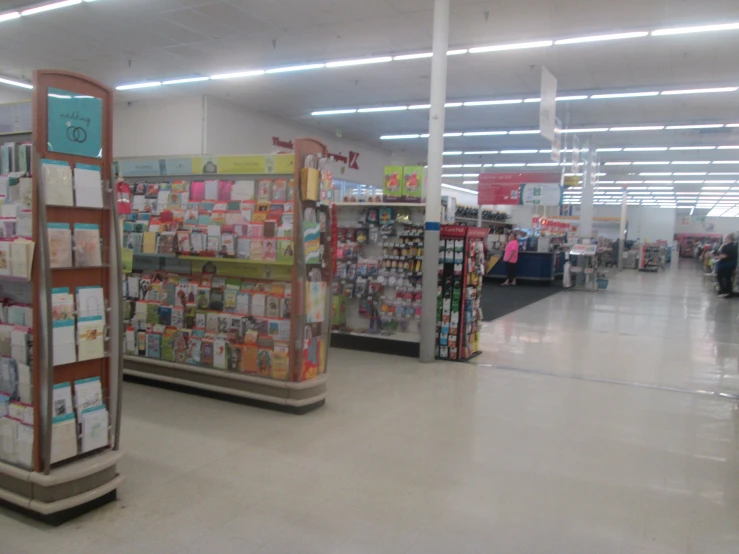 the interior of a store with cards and paper goods on display