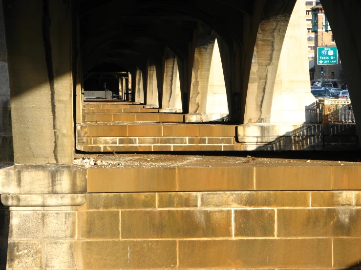 the side of an overpass bridge in the city