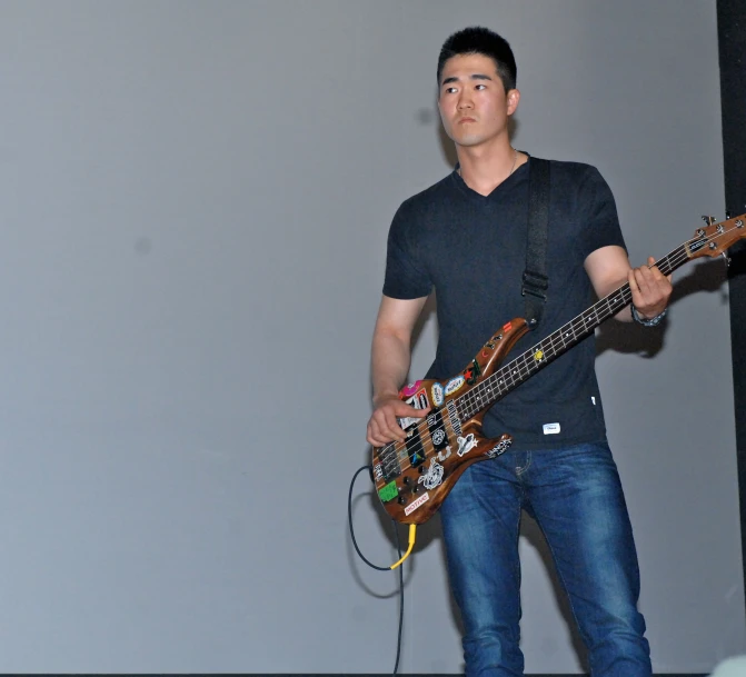 a man is playing the guitar at a music festival