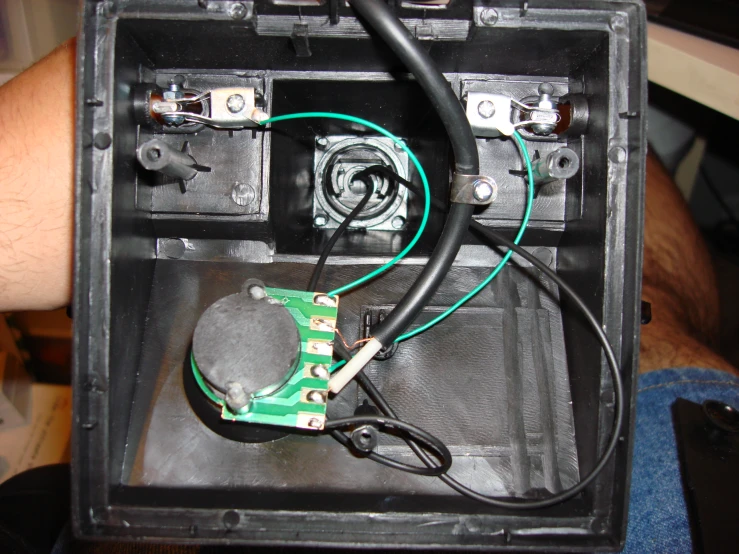 a box containing wires, wires and remote controls