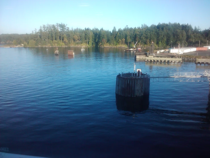 a dock with some small boats on the water