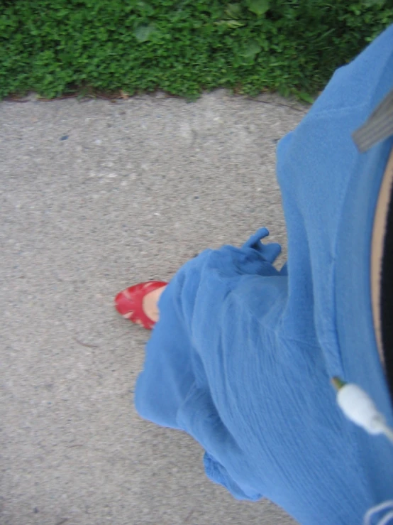 a person with red shoes walking away from the camera