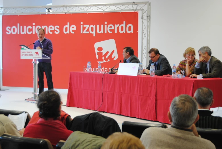 a person is standing behind the podium