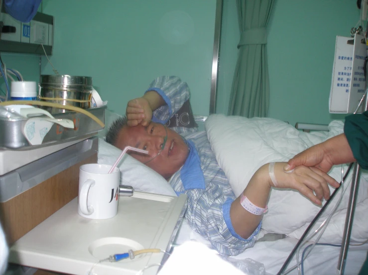 a person laying down in a hospital bed