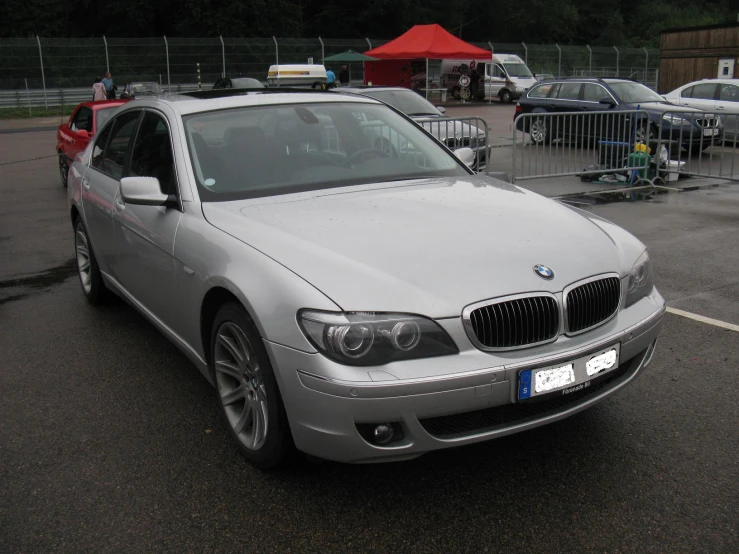 an image of a silver bmw car parked in the lot