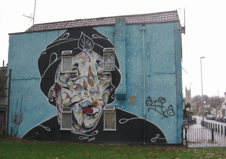 an image on a building of a man in the middle of a street