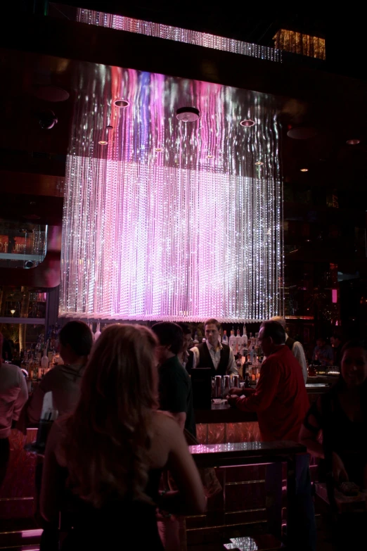 a neon display is hanging in the middle of a room