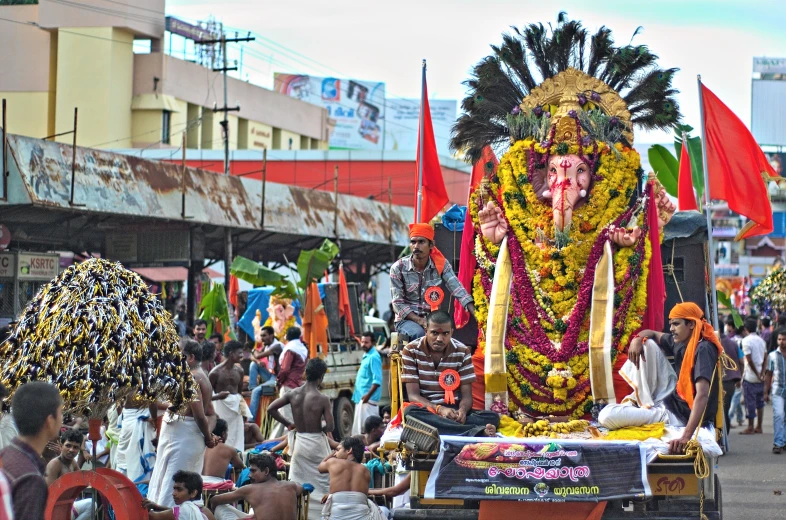 a parade with a colorful gan gan and people