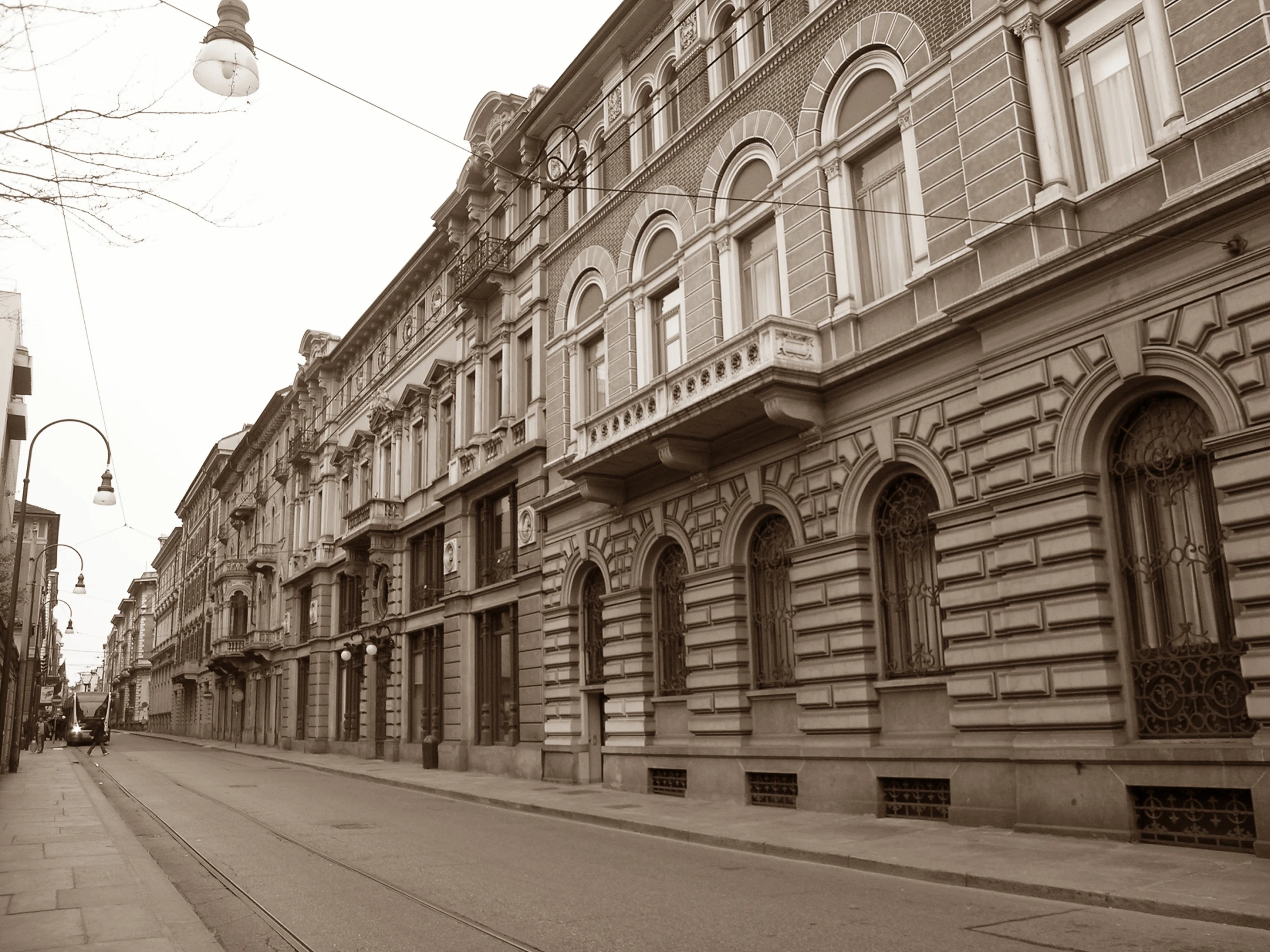 vintage po of the side of buildings with a long walkway on the far corner