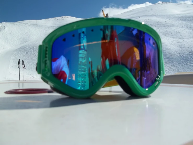 a pair of green glasses on a table