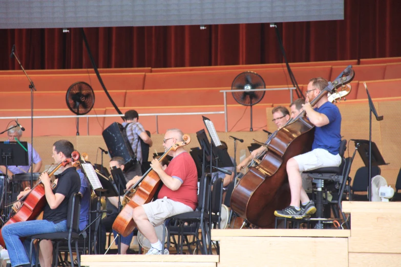 a big group of musicians playing in a concert