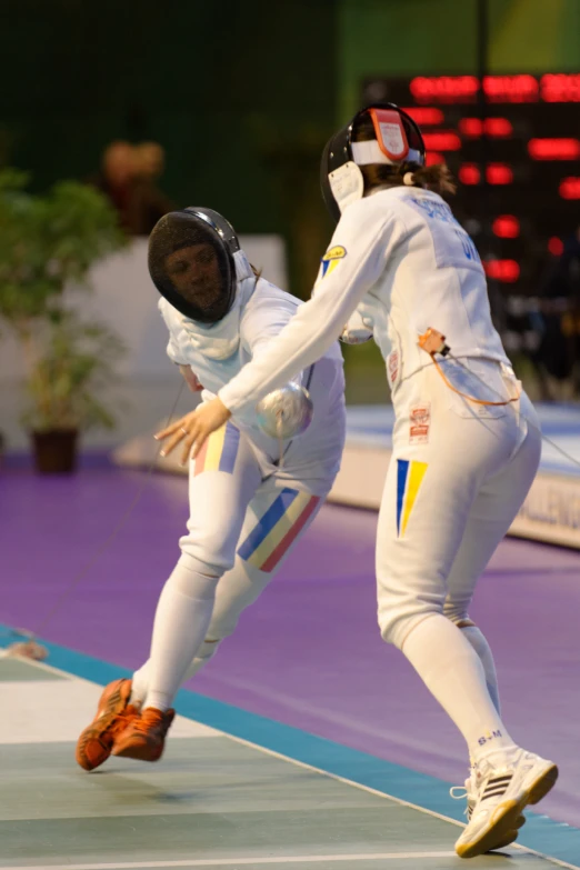 two fencing players compete in an artistic competition