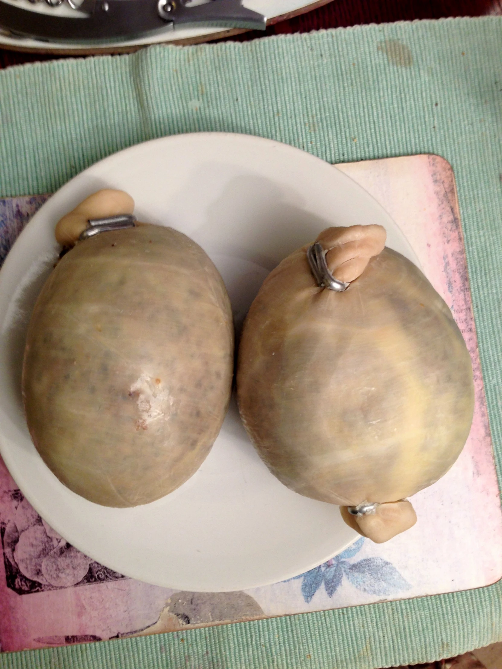 two pears sitting on top of a white plate