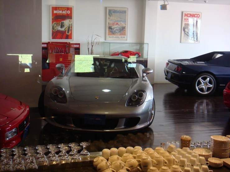 a garage filled with sports cars and racing memorabilia