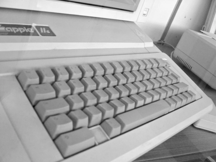 there is a old computer with two keyboards on it