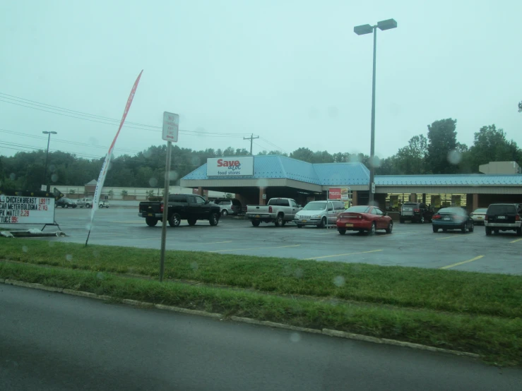 several trucks are parked outside of a restaurant