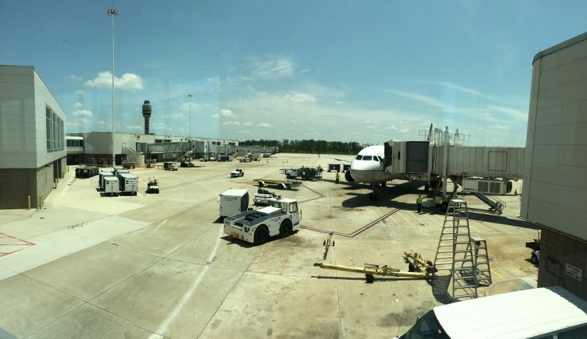 an airport with a large white plane parked near it