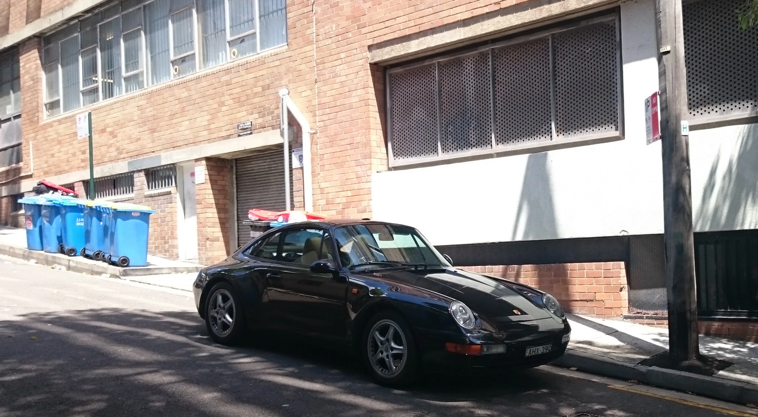 a car parked on the side of a city street